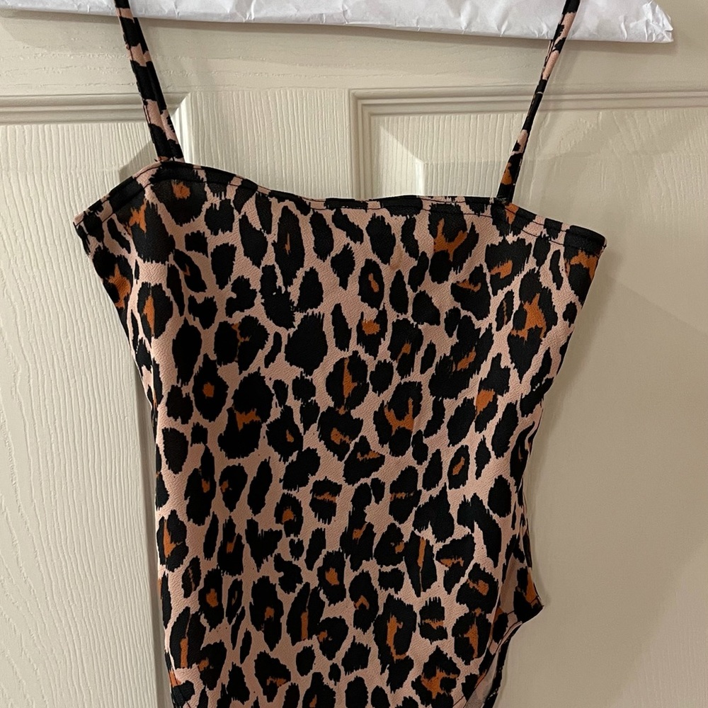 Brand new Cheetah print bodysuit size 4